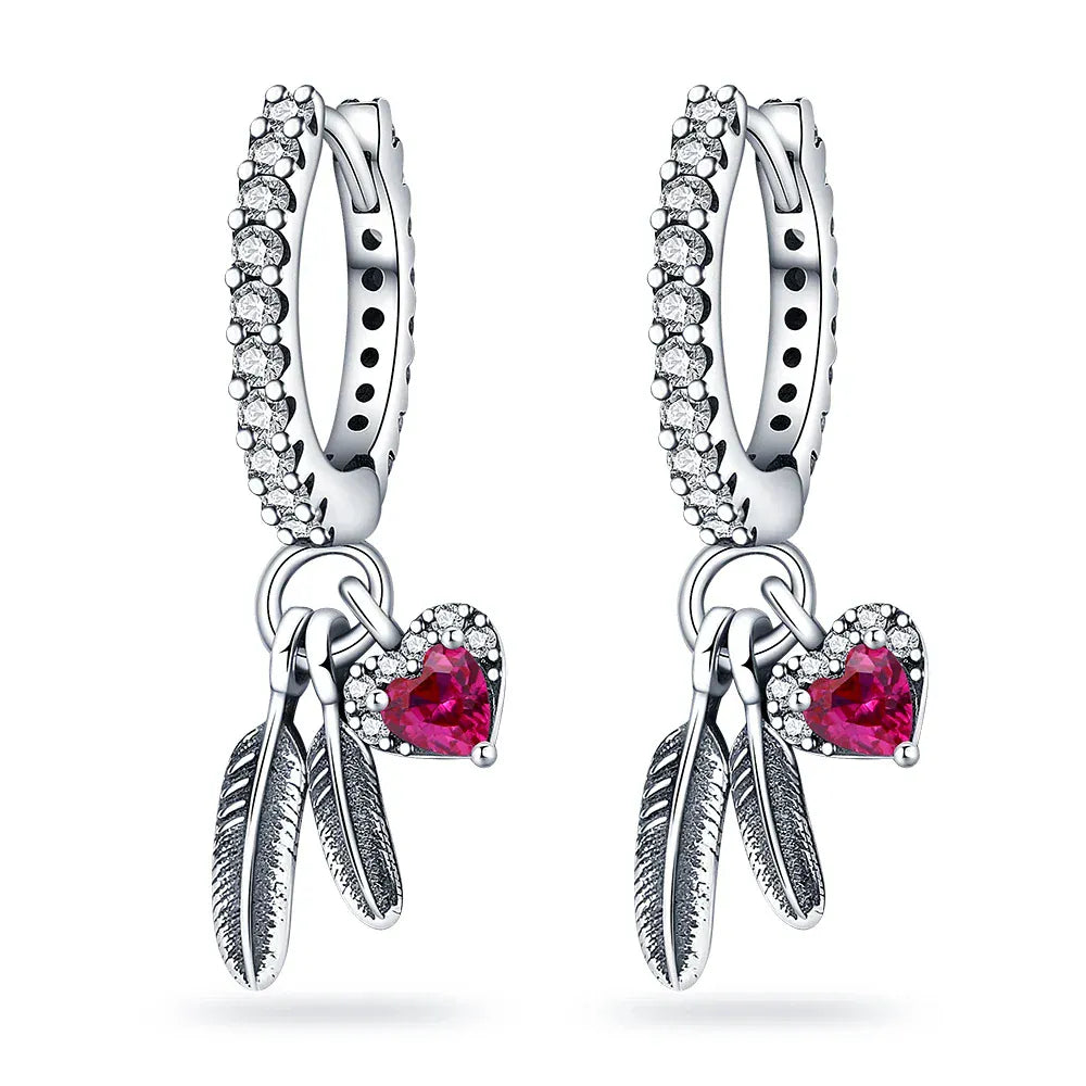 Boucles d'oreilles argentées avec plumes et cœur