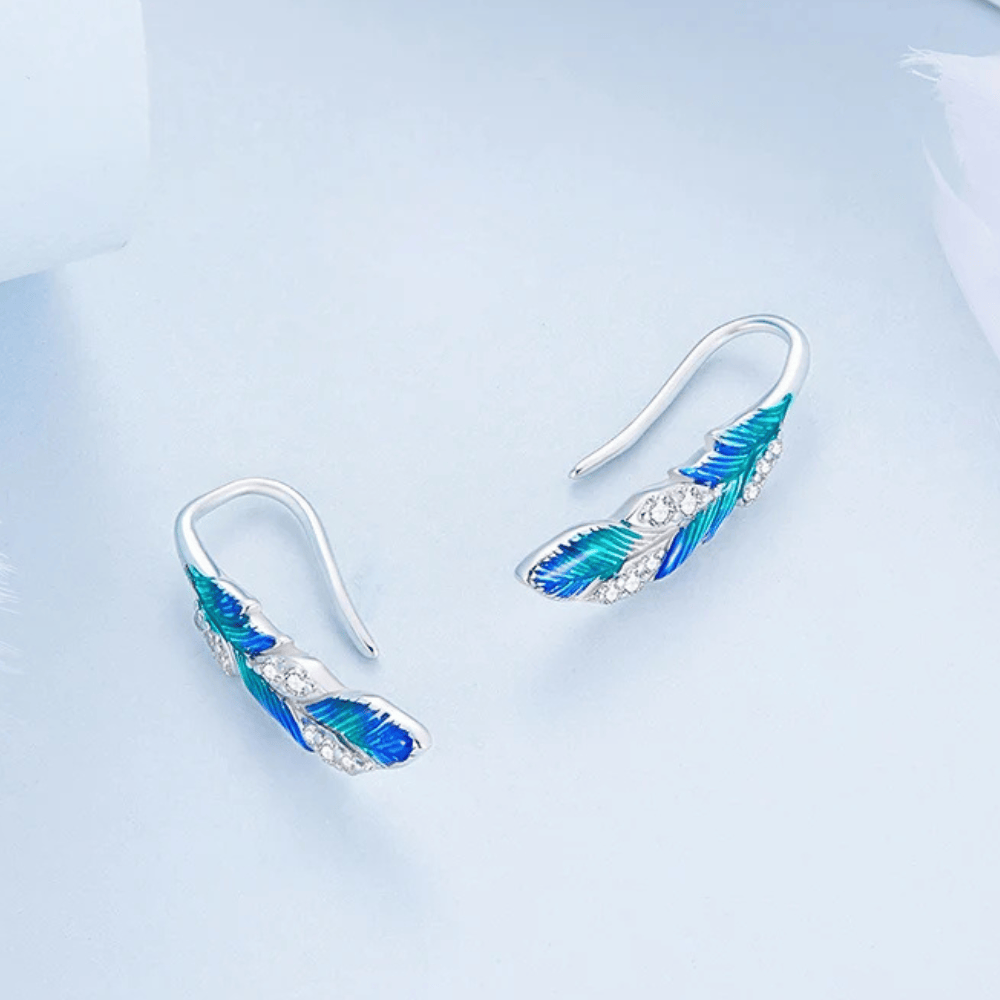 Boucles d'oreilles plume bleue en argent