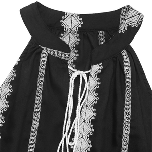 Svart halterneck-blus med vit brodyr och knytband