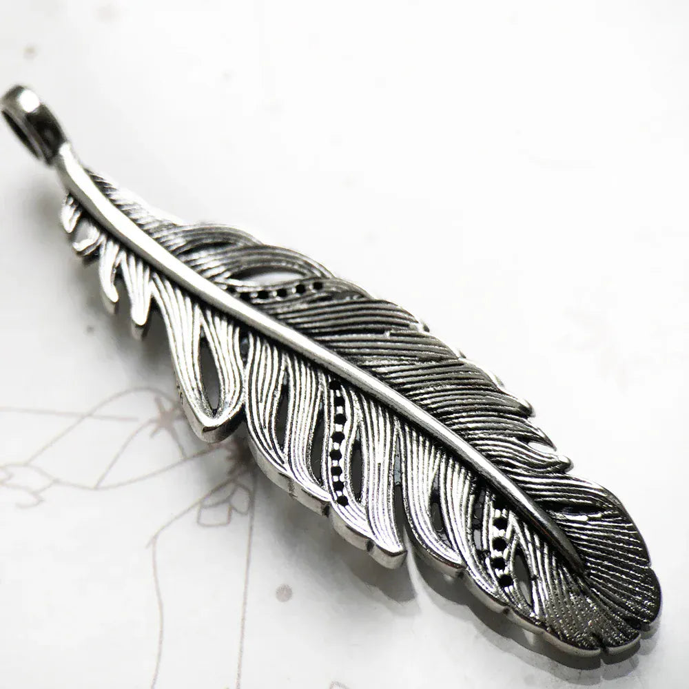 Pendentif vintage plume en argent