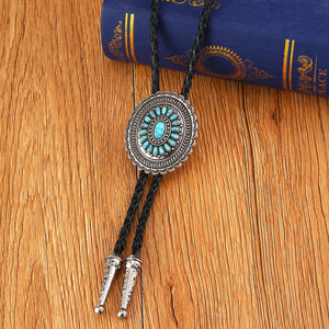 Bolo tie i solrosformad metallram och turkos sten Turkosblå