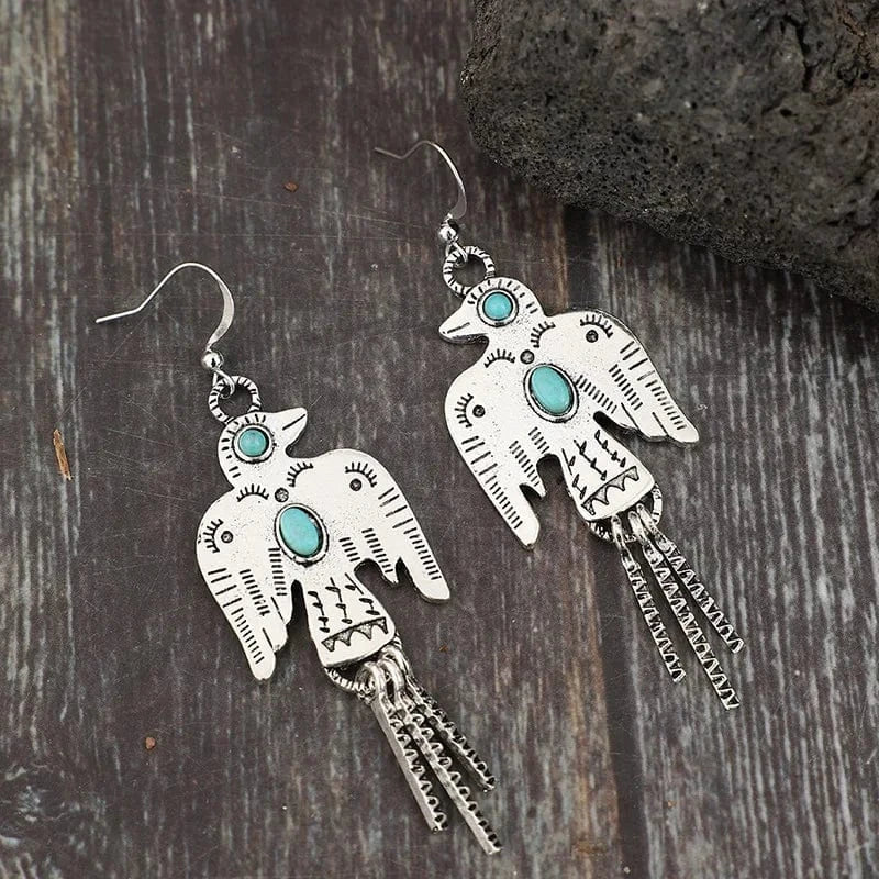 Örhängen i silver med Thunderbird-fågel och turkos Silver med turkos